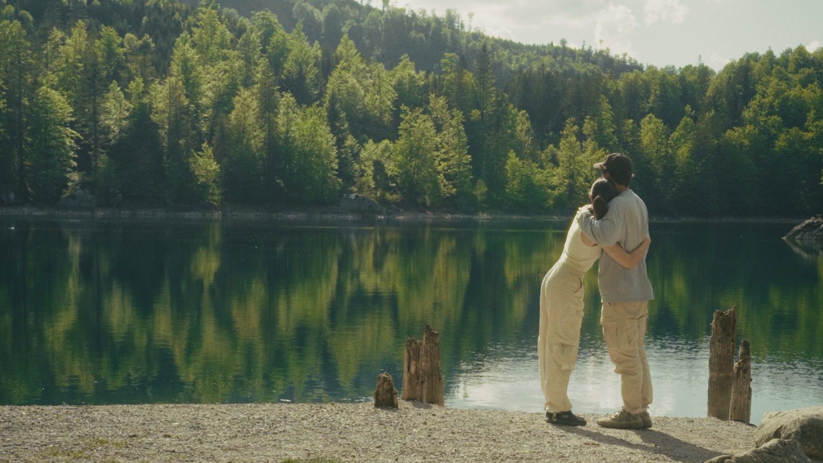 Couple embracing by a lake - choosing the childfree lifestyle intentionally